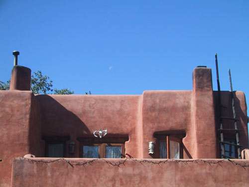 Adobe house and moon, across from San Miguel Mission. We tried to get this moon in as many pictures as possible.