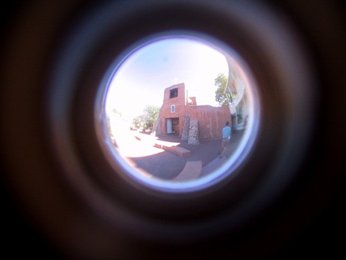 The Mission of San Miguel through a peephole.